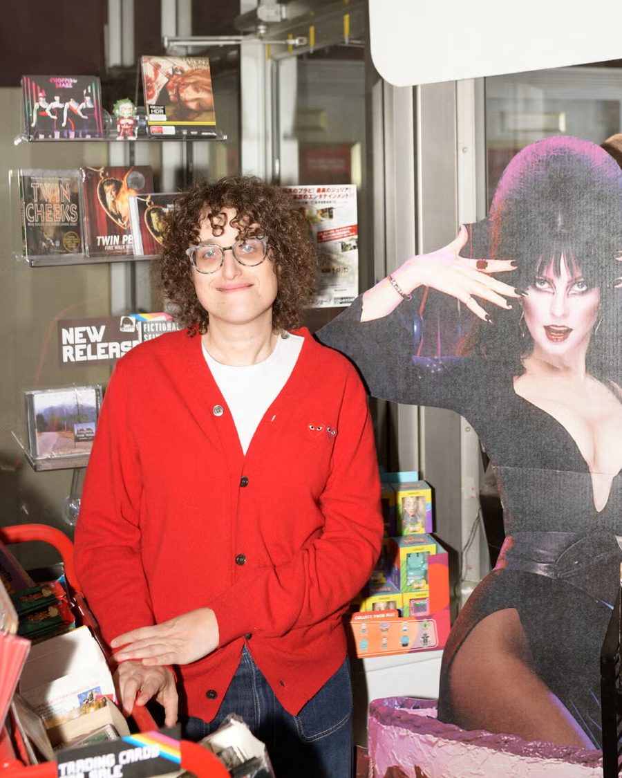 Jane Schoenbrun at Sleepover Trading Co. in Catskill, next to the Elvira standee